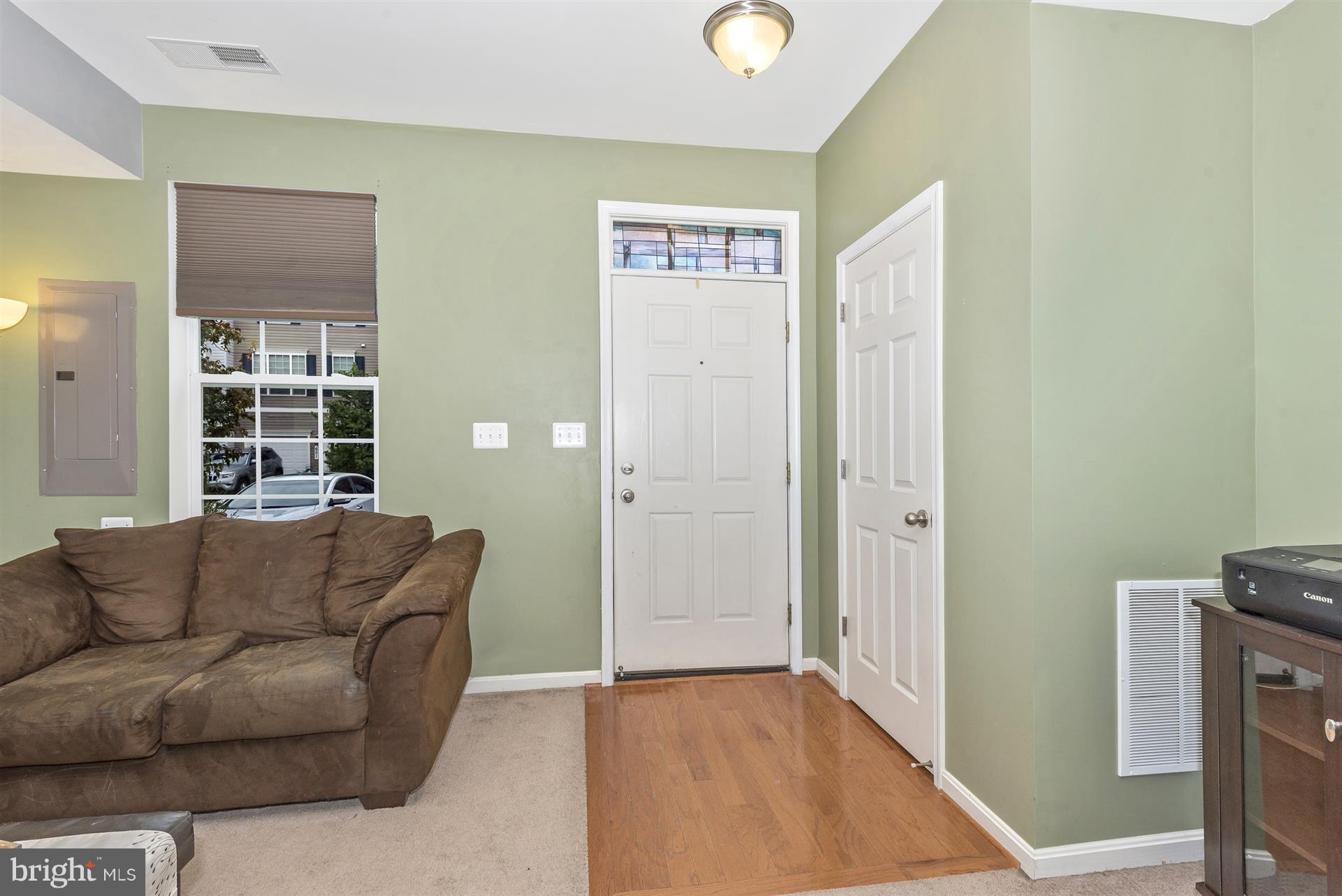 640 Tivoli Road Frederick, MD 21703 - Photo 4 of 29 Hardwood flooring at entryway w/coat closet