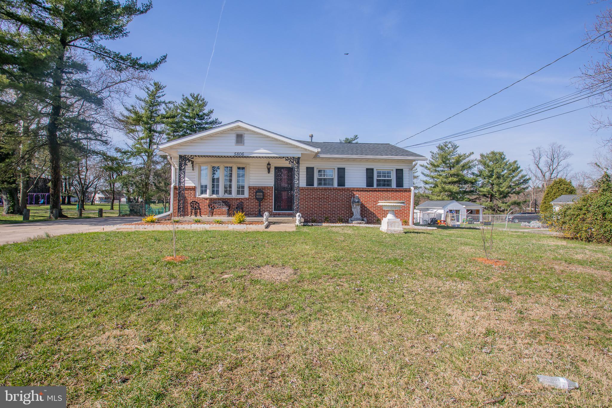 5806 Olson Road Brooklyn, MD 21225 - Photo 2 of 33 a front view of a house with garden
