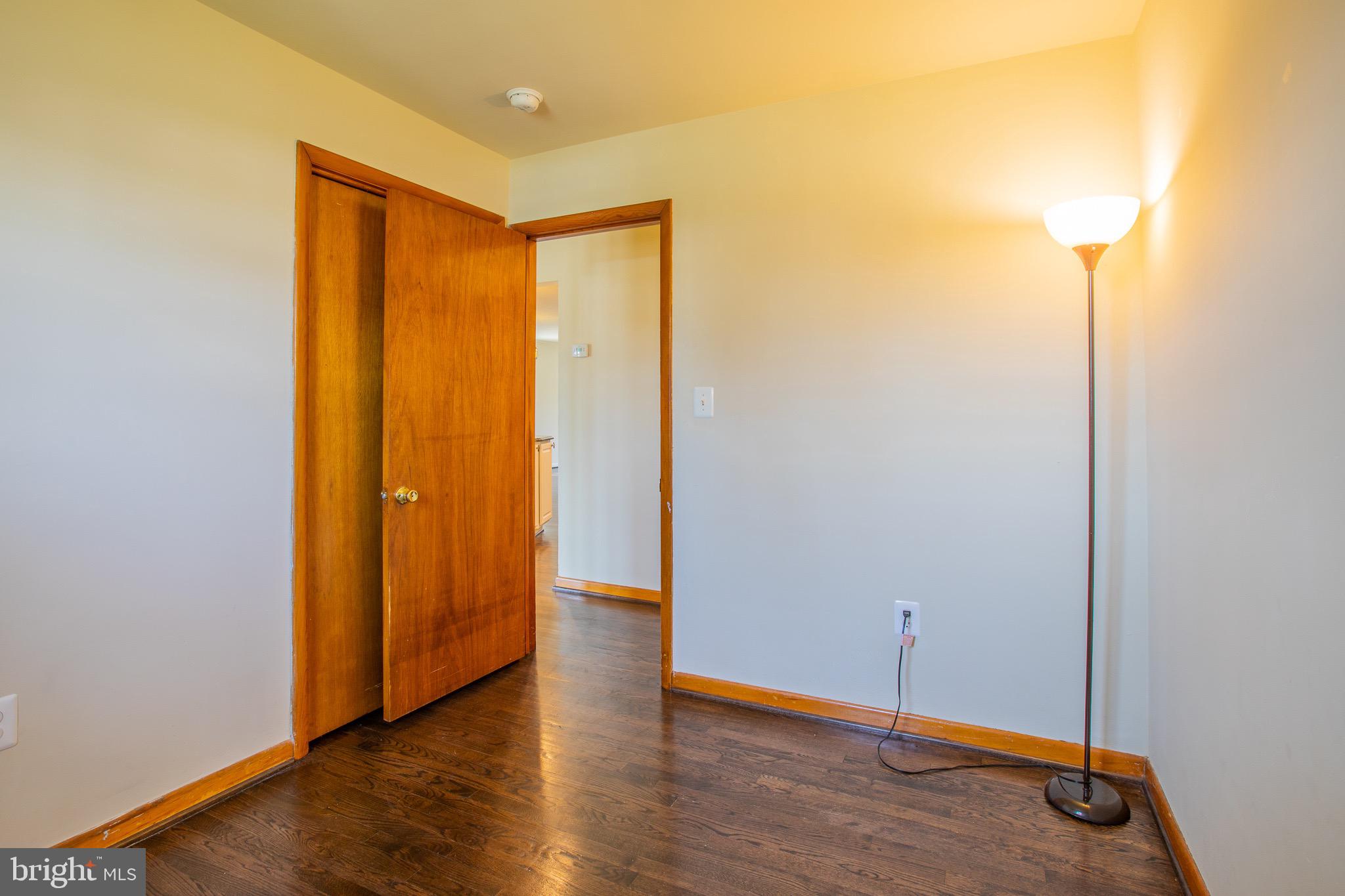 5806 Olson Road Brooklyn, MD 21225 - Photo 21 of 33 a view of an empty room with wooden floor