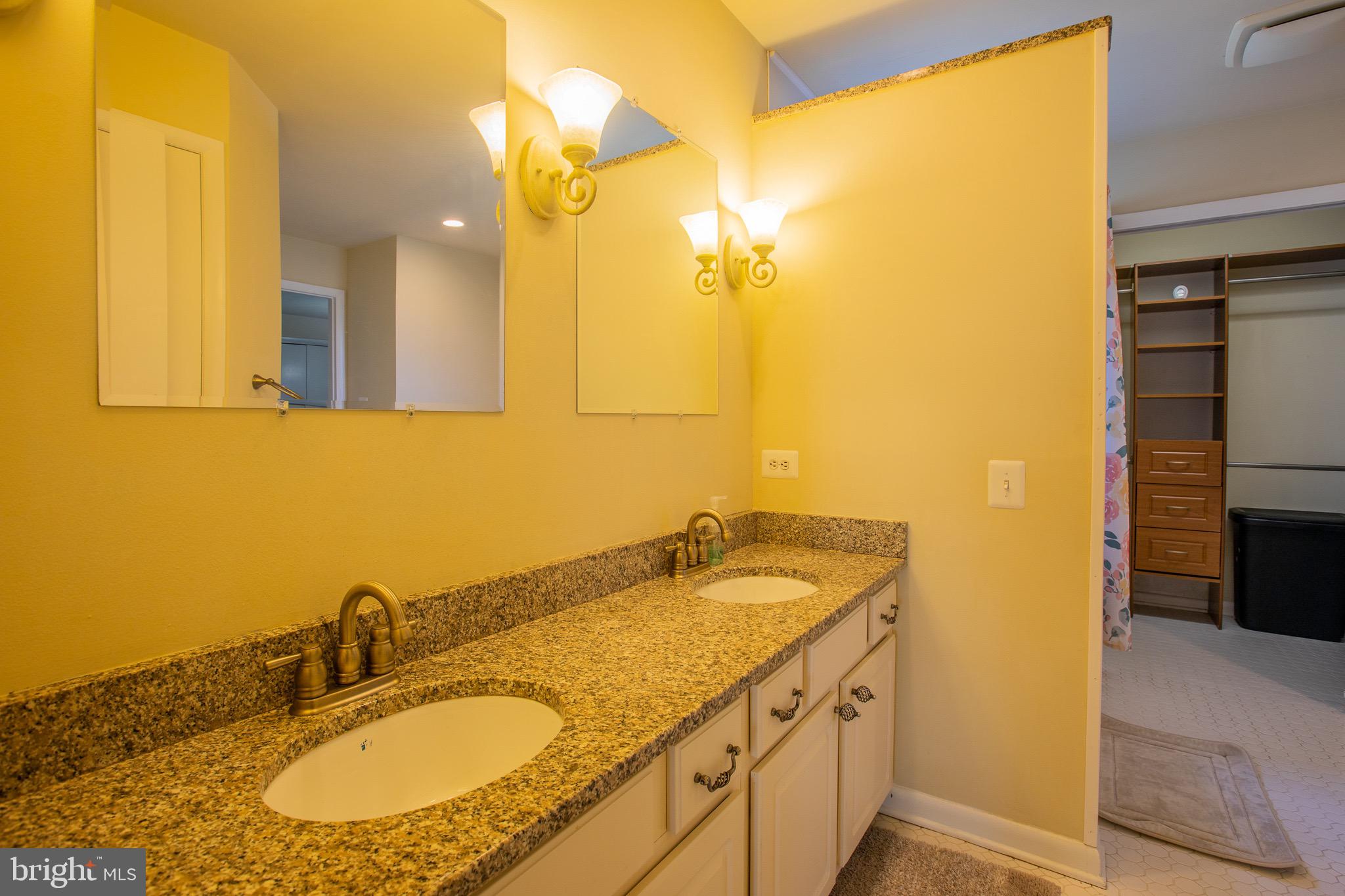 5806 Olson Road Brooklyn, MD 21225 - Photo 24 of 33 a bathroom with a granite countertop sink and a mirror