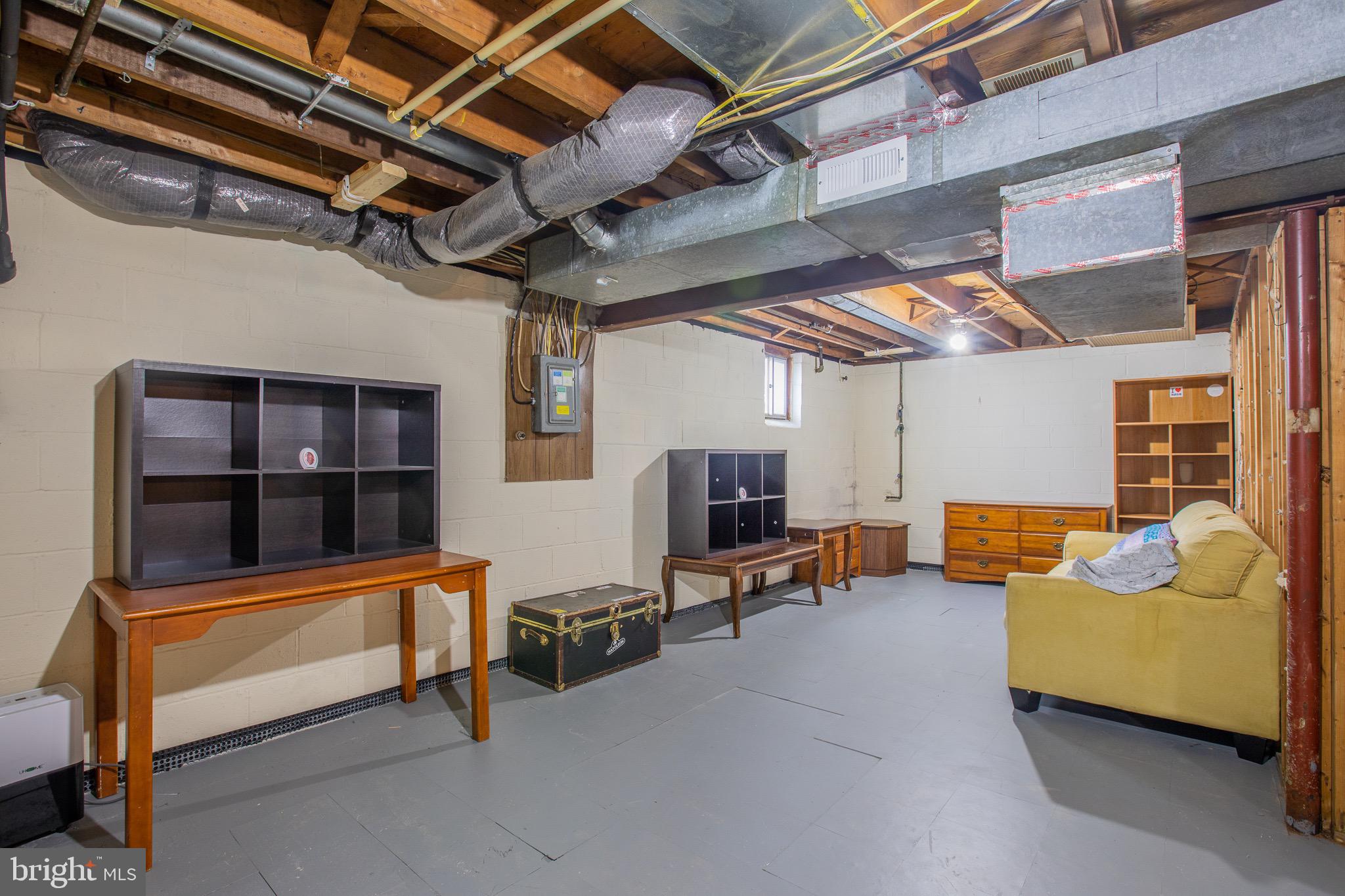 5806 Olson Road Brooklyn, MD 21225 - Photo 28 of 33 a outdoor space with patio furniture and a flat screen tv