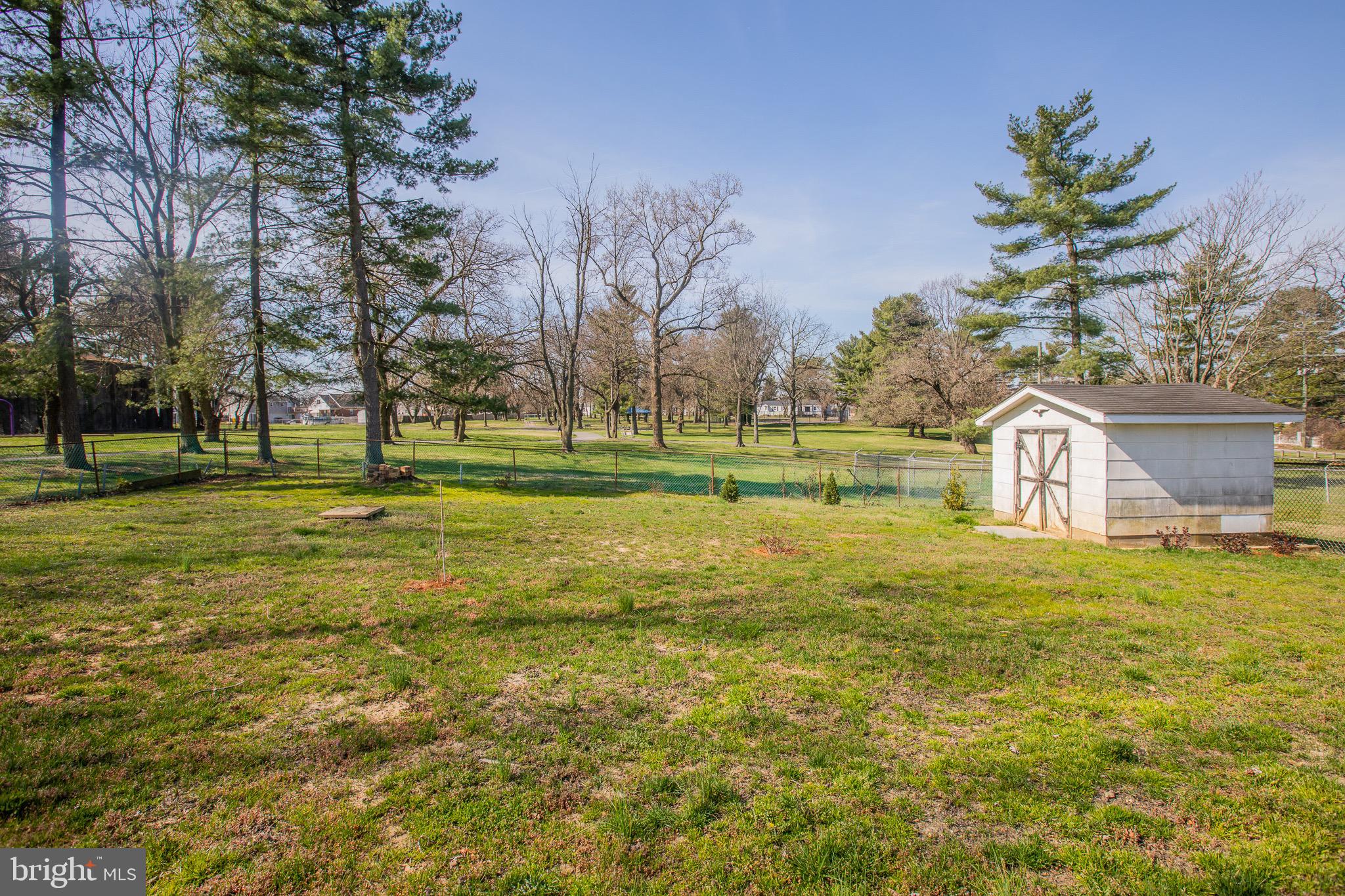 5806 Olson Road Brooklyn, MD 21225 - Photo 31 of 33 a view of a playground with a big yard and palm trees