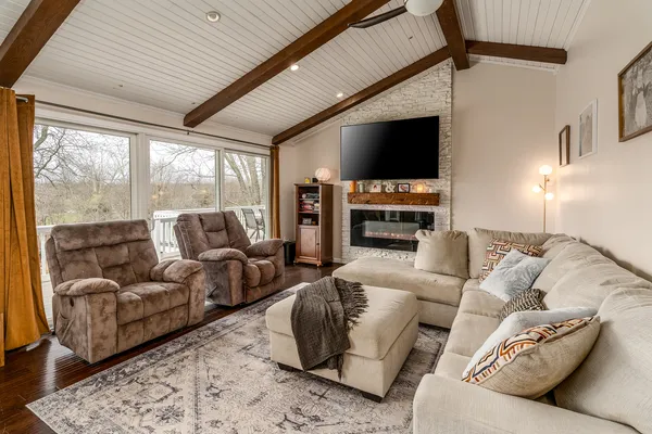 a living room with furniture and a dining table