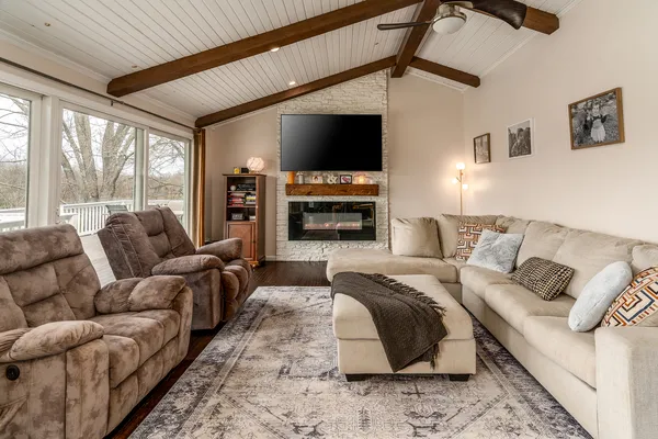 a living room with furniture and a fireplace