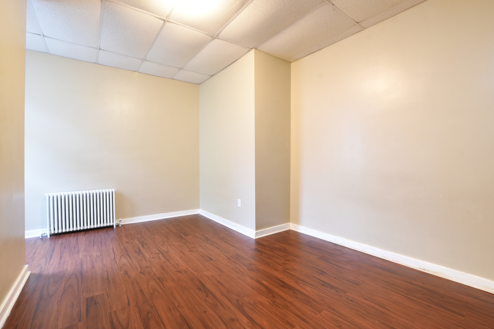 255 North Spring Street Elgin, IL 60120 - Photo 4 of 6 a view of an empty room with wooden floor