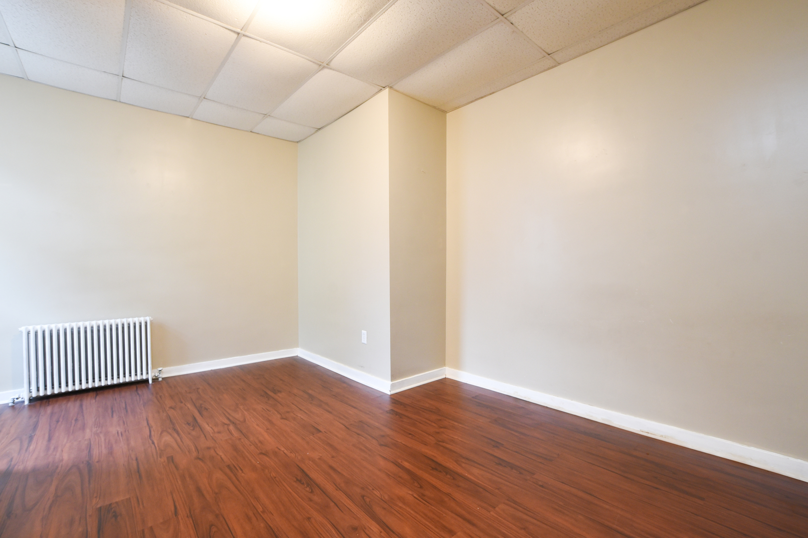 255 North Spring Street Elgin, IL 60120 - Photo 5 of 6 a view of an empty room with wooden floor