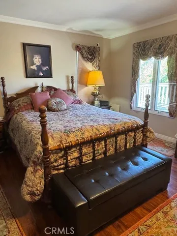 a bedroom with bed and window