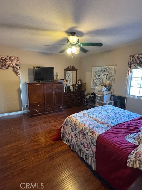 10821 Vida Drive Villa Park, CA 92861 - Photo 24 of 39 a bedroom with a bed and wooden floor