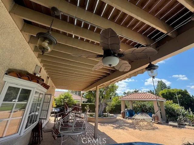 a view of a chairs and table in the patio
