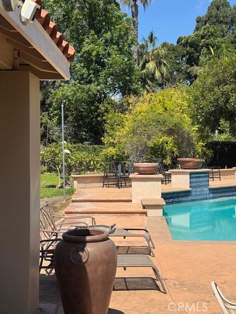 10821 Vida Drive Villa Park, CA 92861 - Photo 36 of 39 a view of a patio with table and chairs with wooden floor and fence