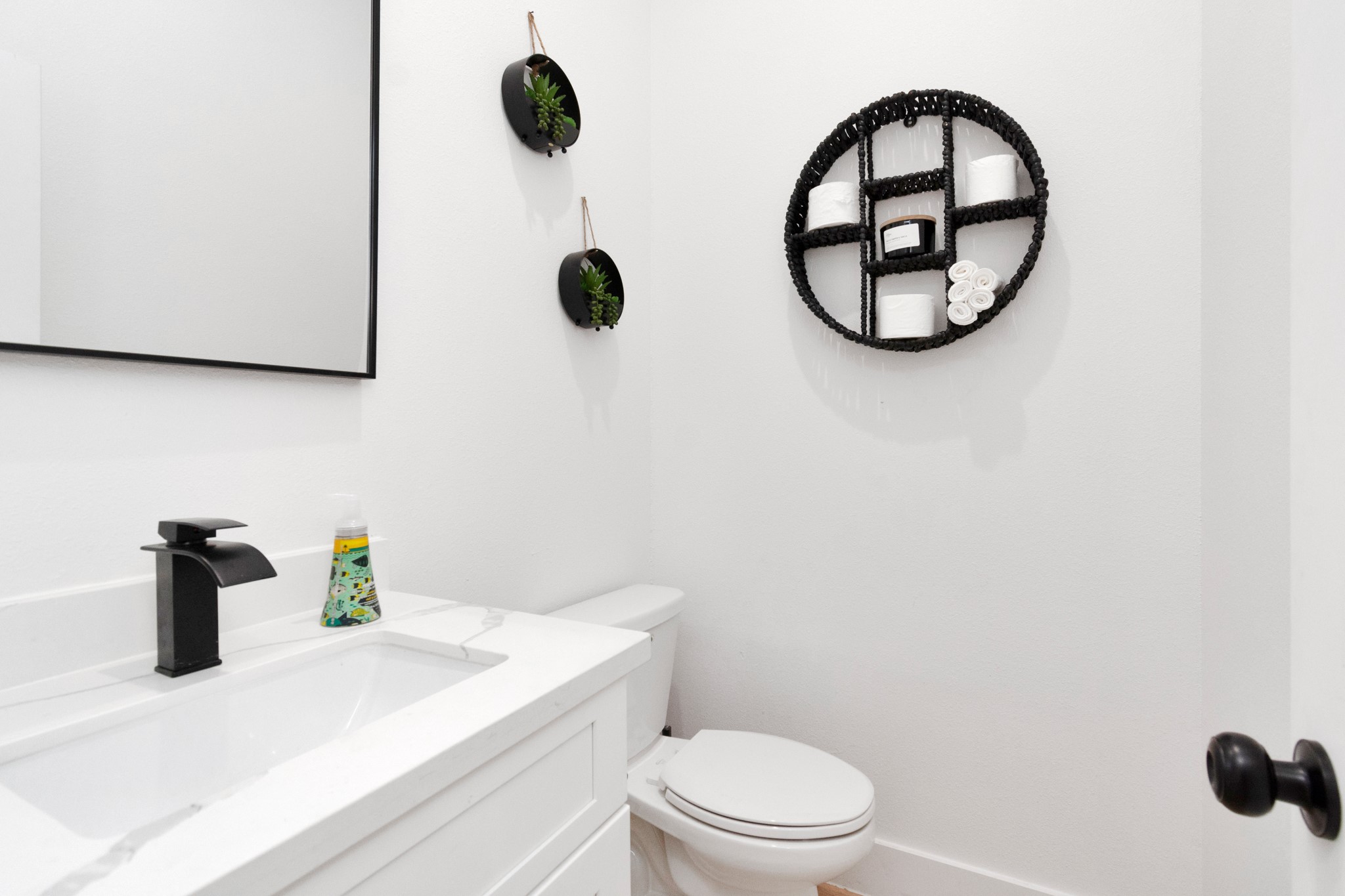5308 Denmark Street Houston, TX 77028 - Photo 16 of 36 a bathroom with a sink and a mirror