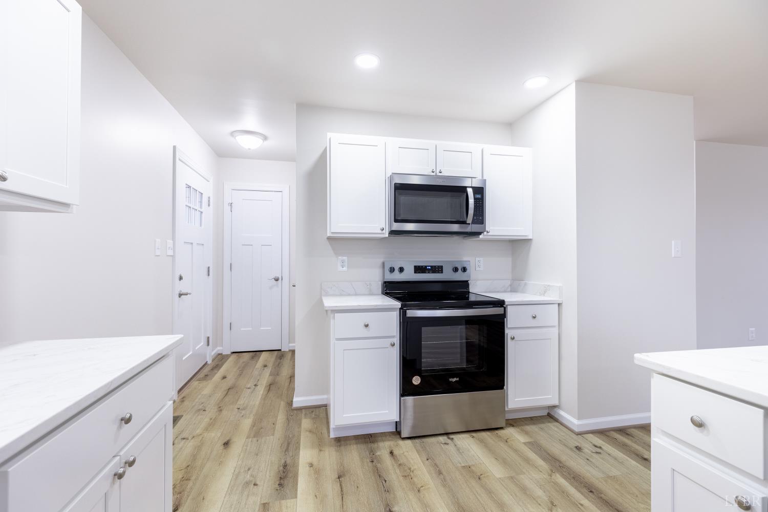 1104 15th Street Altavista, VA 24517 - Photo 15 of 47 a kitchen with stainless steel appliances a stove microwave and sink