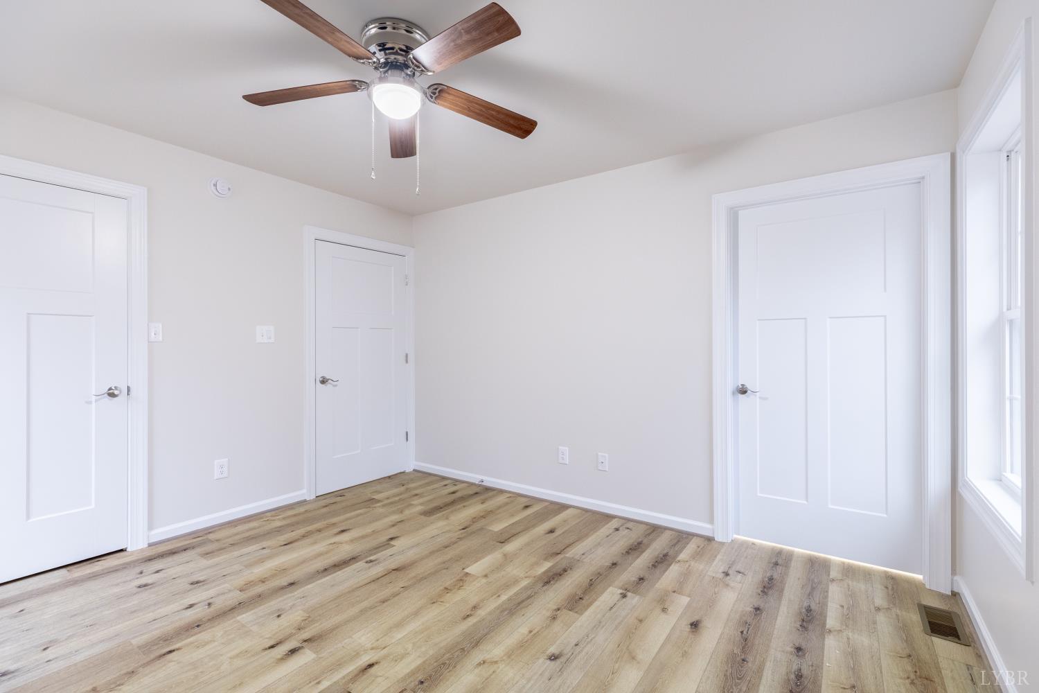 1104 15th Street Altavista, VA 24517 - Photo 19 of 47 a view of empty room with wooden floor
