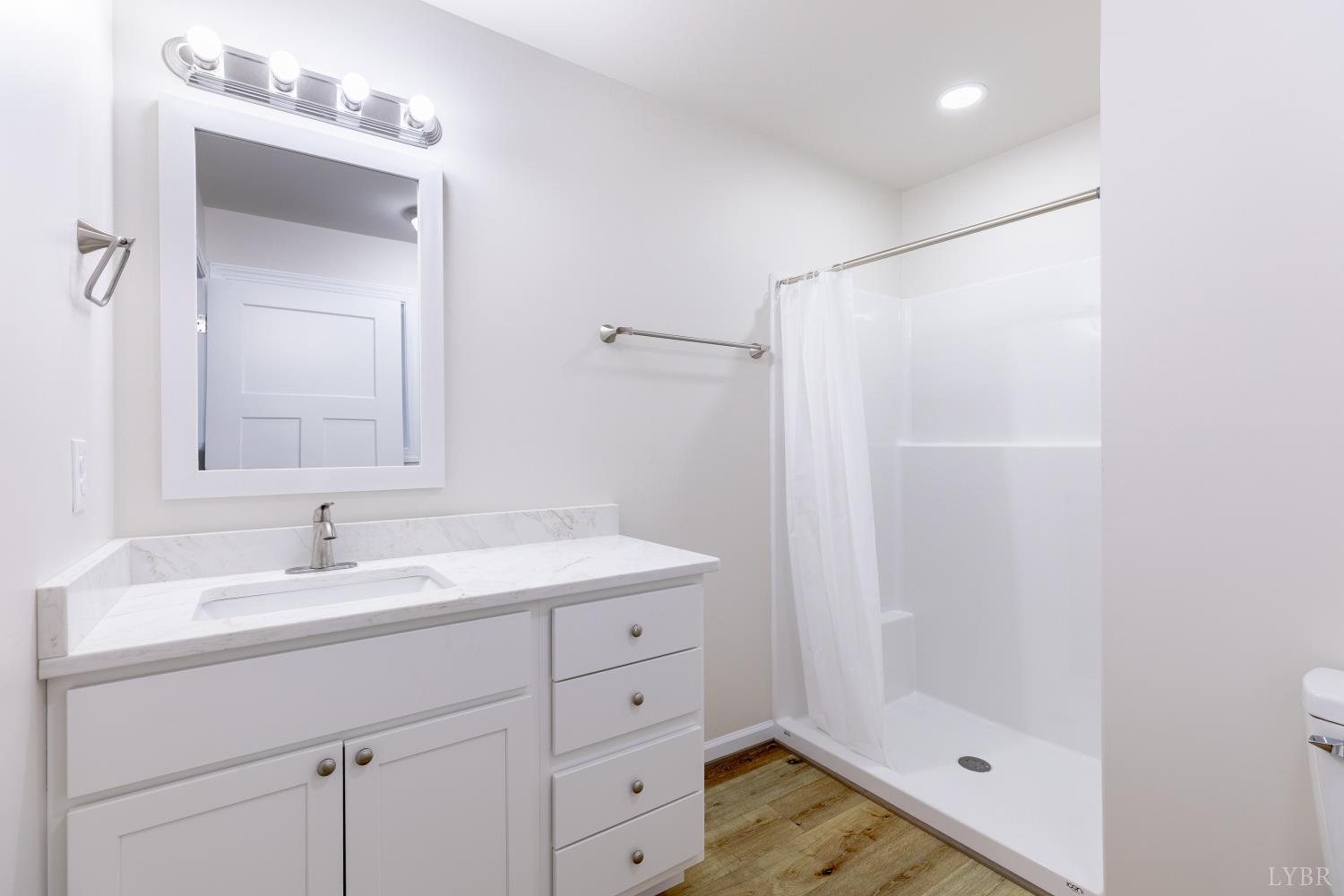 1104 15th Street Altavista, VA 24517 - Photo 20 of 47 a bathroom with a shower sink and mirror