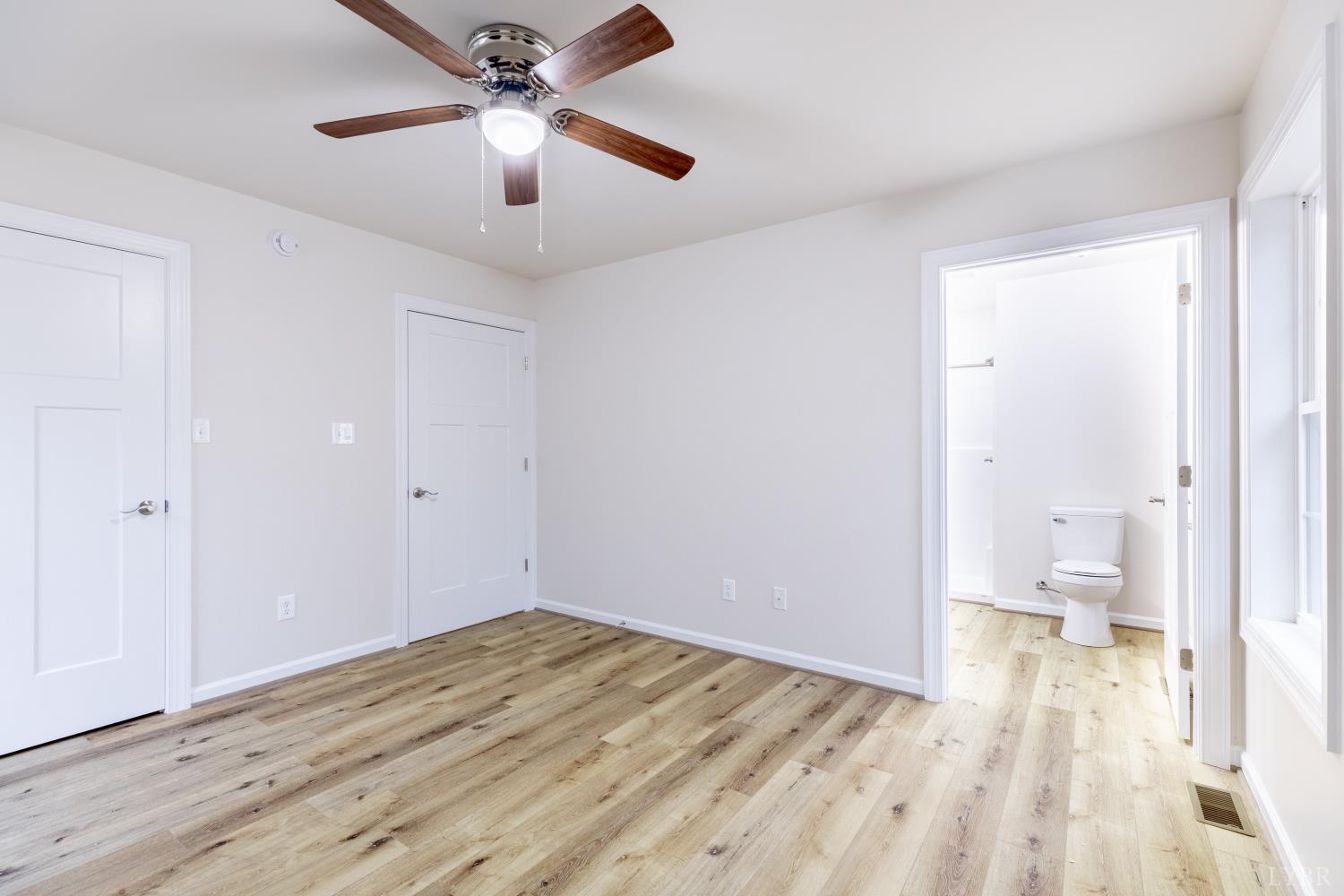 1104 15th Street Altavista, VA 24517 - Photo 34 of 47 a view of a room with wooden floor and a ceiling fan