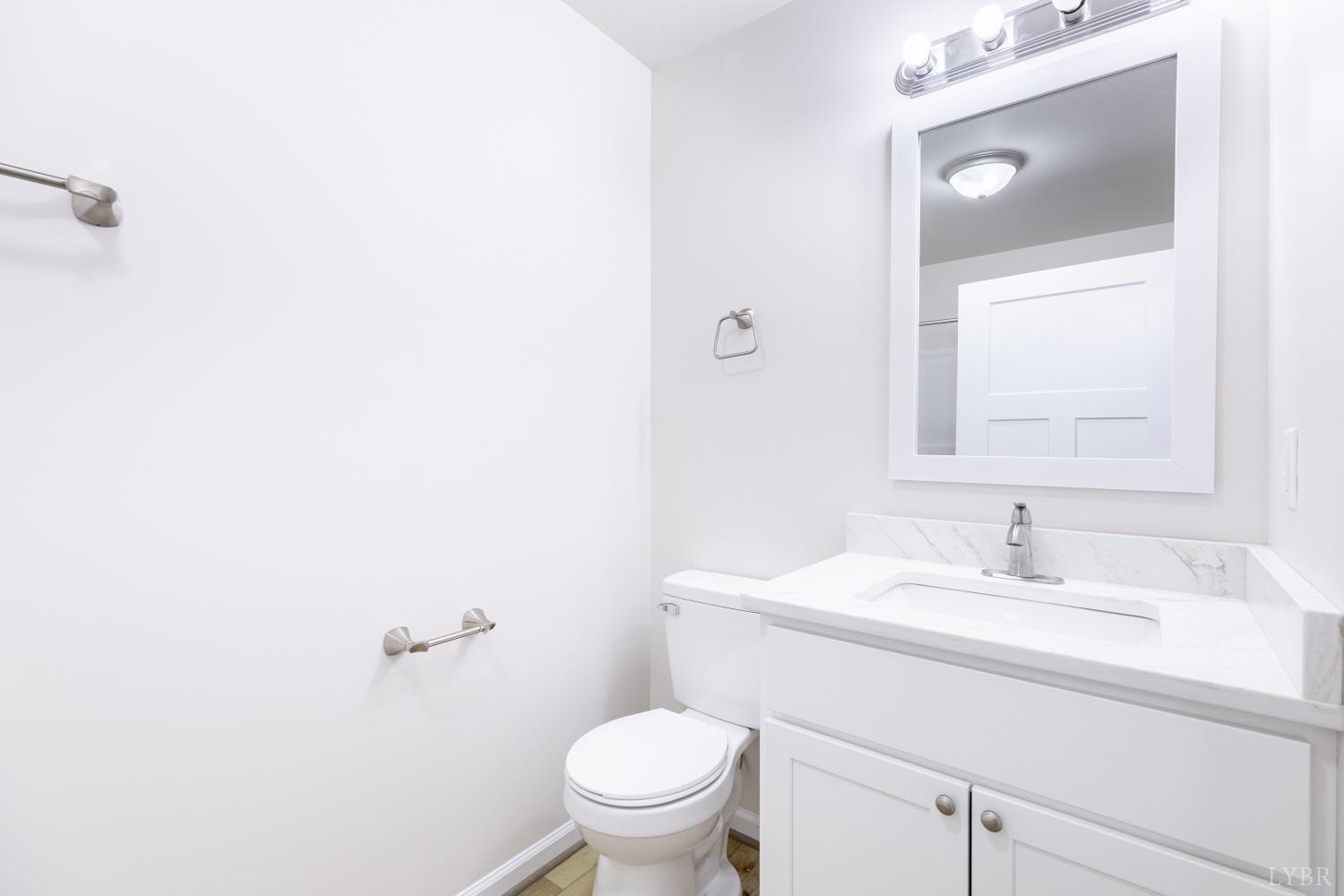 1104 15th Street Altavista, VA 24517 - Photo 36 of 47 a bathroom with a sink toilet and a mirror