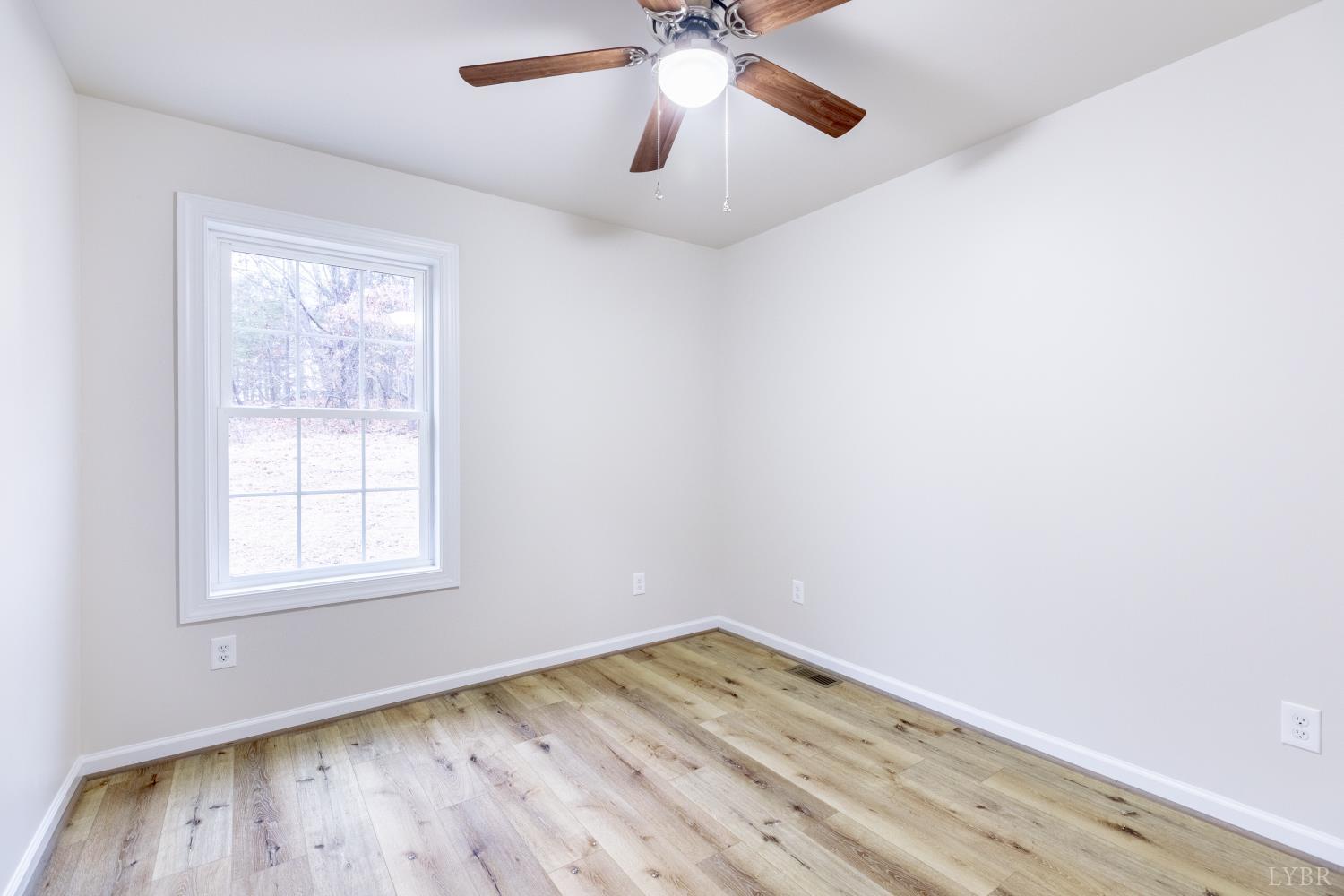 1104 15th Street Altavista, VA 24517 - Photo 38 of 47 an empty room with a window and wooden floor