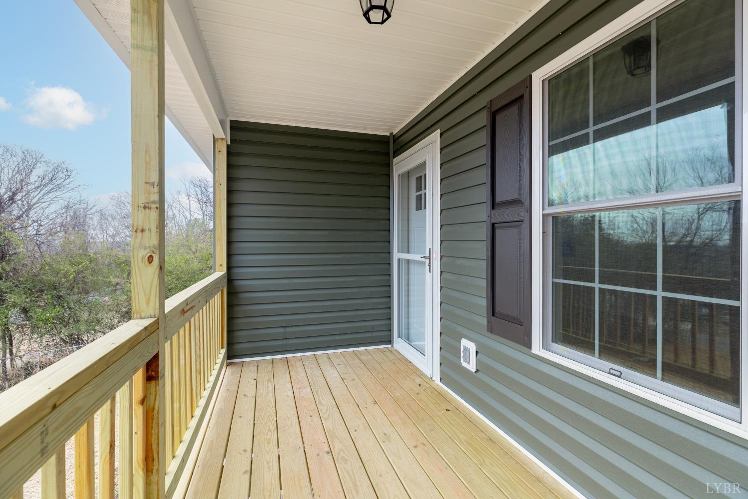 1104 15th Street Altavista, VA 24517 - Photo 40 of 47 a view of a balcony with wooden floor and fence