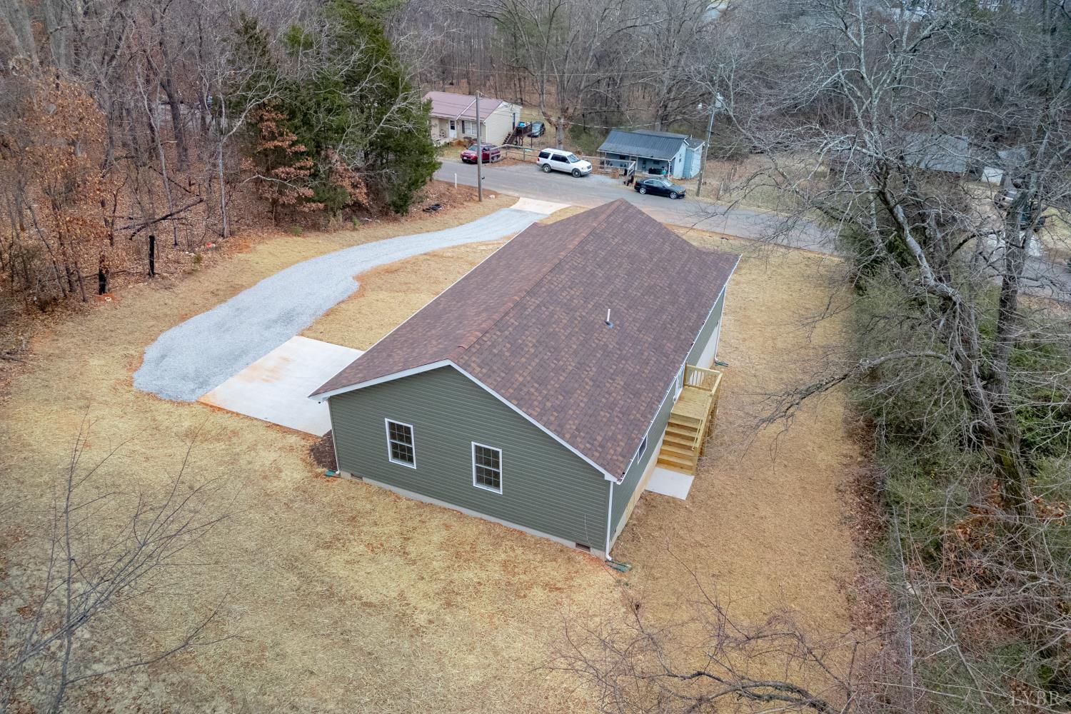 1104 15th Street Altavista, VA 24517 - Photo 46 of 47 an aerial view of a house with yard and trees in the background
