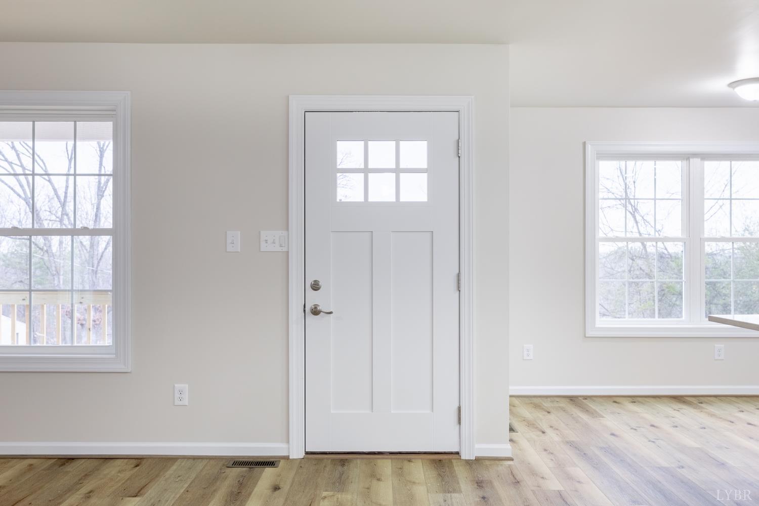 1104 15th Street Altavista, VA 24517 - Photo 5 of 47 an empty room with wooden floor and windows
