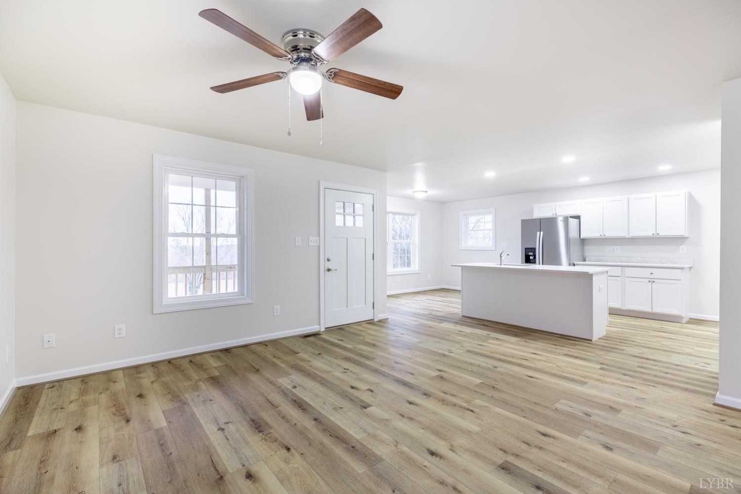 1104 15th Street Altavista, VA 24517 - Photo 7 of 47 a view of an empty room with window and wooden floor