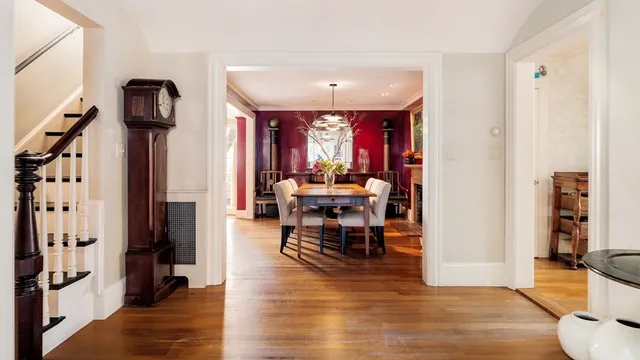 a dining room with furniture and wooden floor