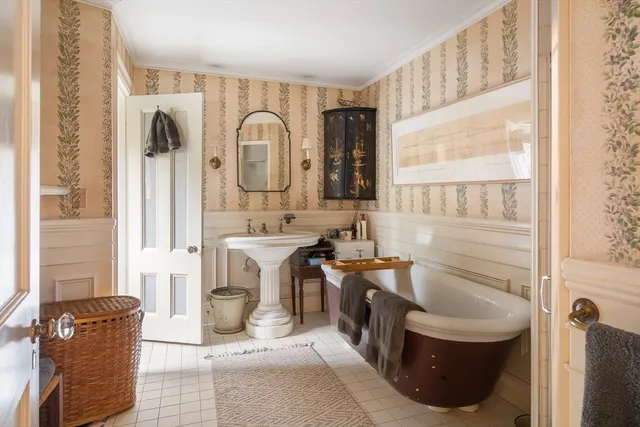 a bathroom with a sink a toilet and tub