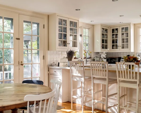 a view of a dining room with furniture and windows