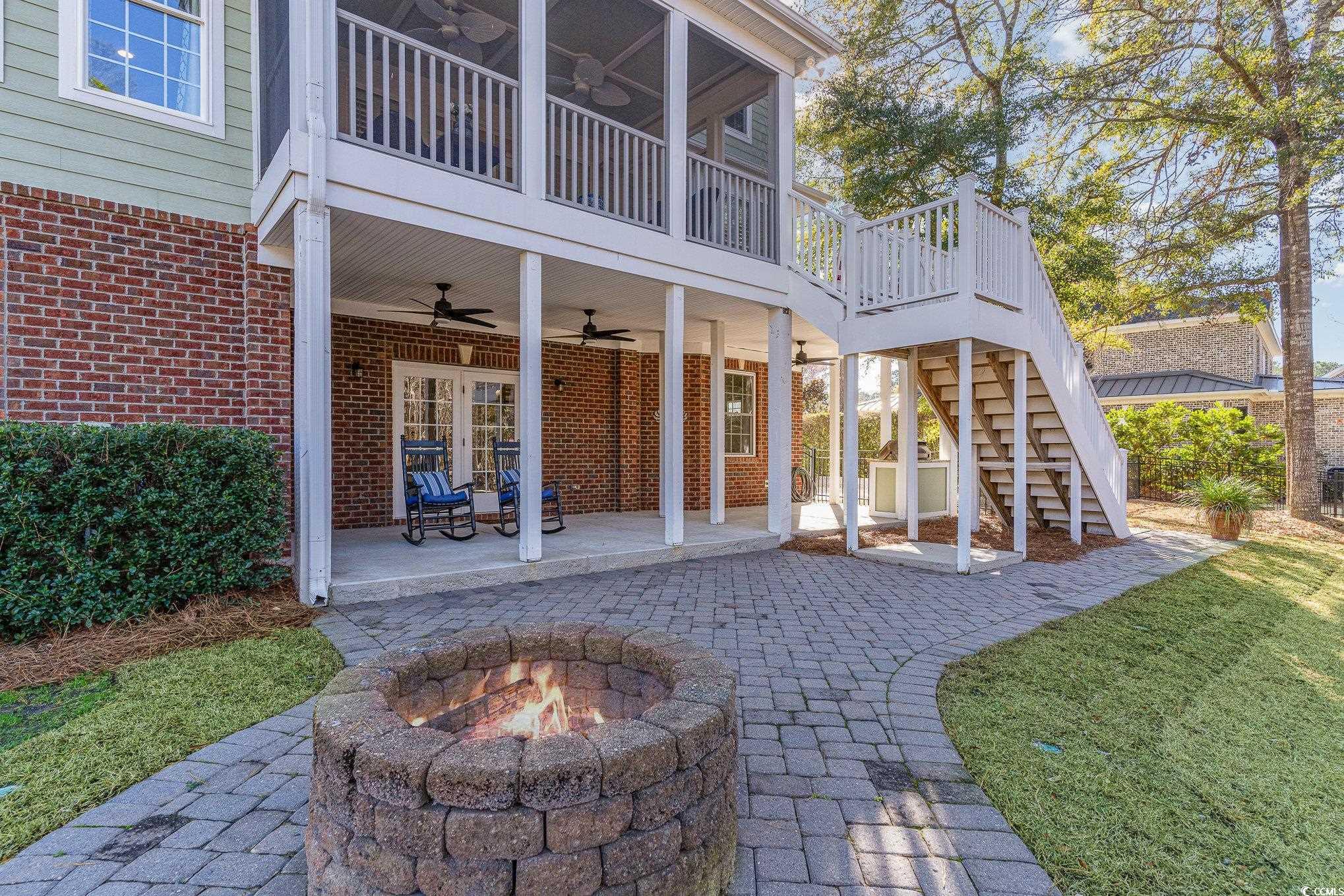 80 Stonington Drive Murrells Inlet, SC 29576 - Photo 35 of 40 Nice extension of the patio with firepit. Picture before new paint