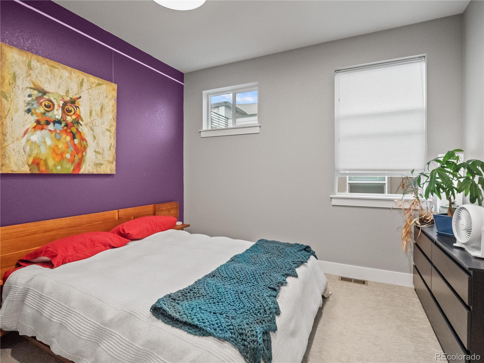 1284 Stuart Street Denver, CO 80204 - Photo 14 of 27 a bedroom with a bed and a window