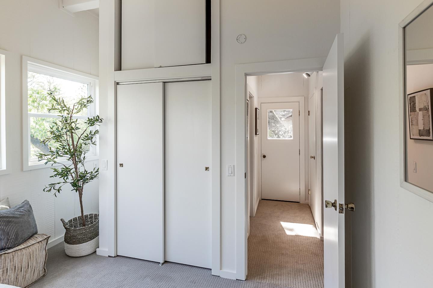 128 Los Trancos Circle Portola Valley, CA 94028 - Photo 18 of 38 a view of a hallway with potted plants