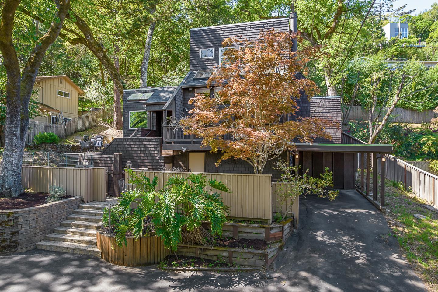128 Los Trancos Circle Portola Valley, CA 94028 - Photo 2 of 38 a view of a house with a garden