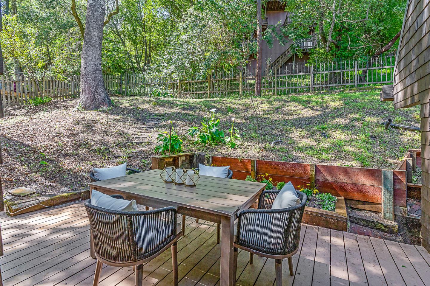 128 Los Trancos Circle Portola Valley, CA 94028 - Photo 25 of 38 a view of backyard with table and chairs and wooden floor
