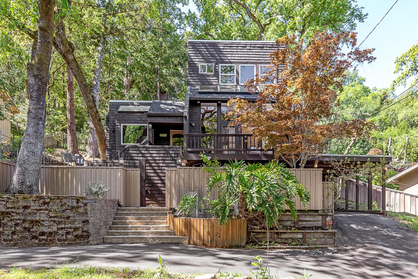 128 Los Trancos Circle Portola Valley, CA 94028 - Photo 38 of 38 a front view of a house with garden