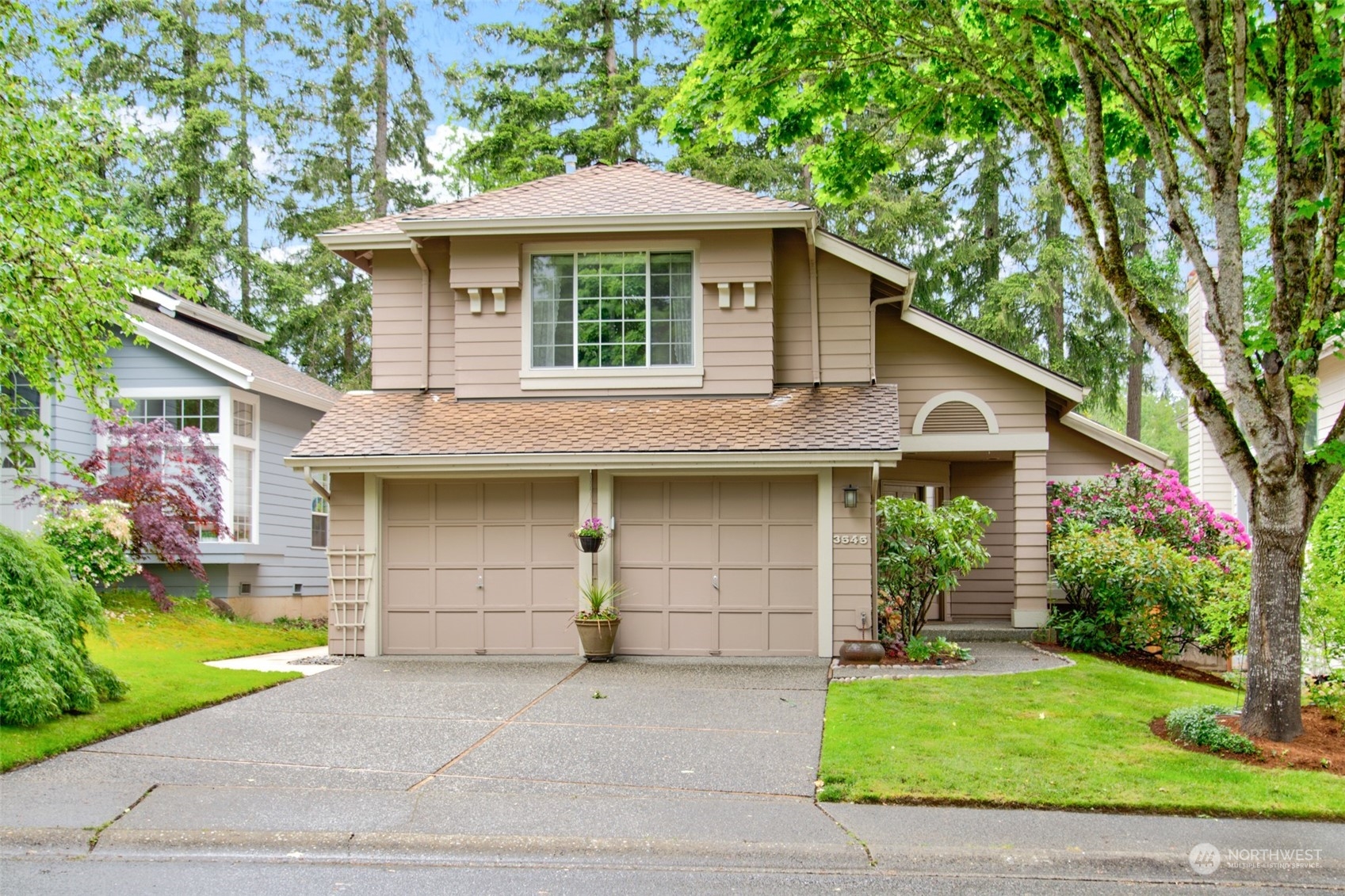 3545 252nd Place Southeast Sammamish, WA 98029 - Photo 1 of 31 a front view of a house with a garden