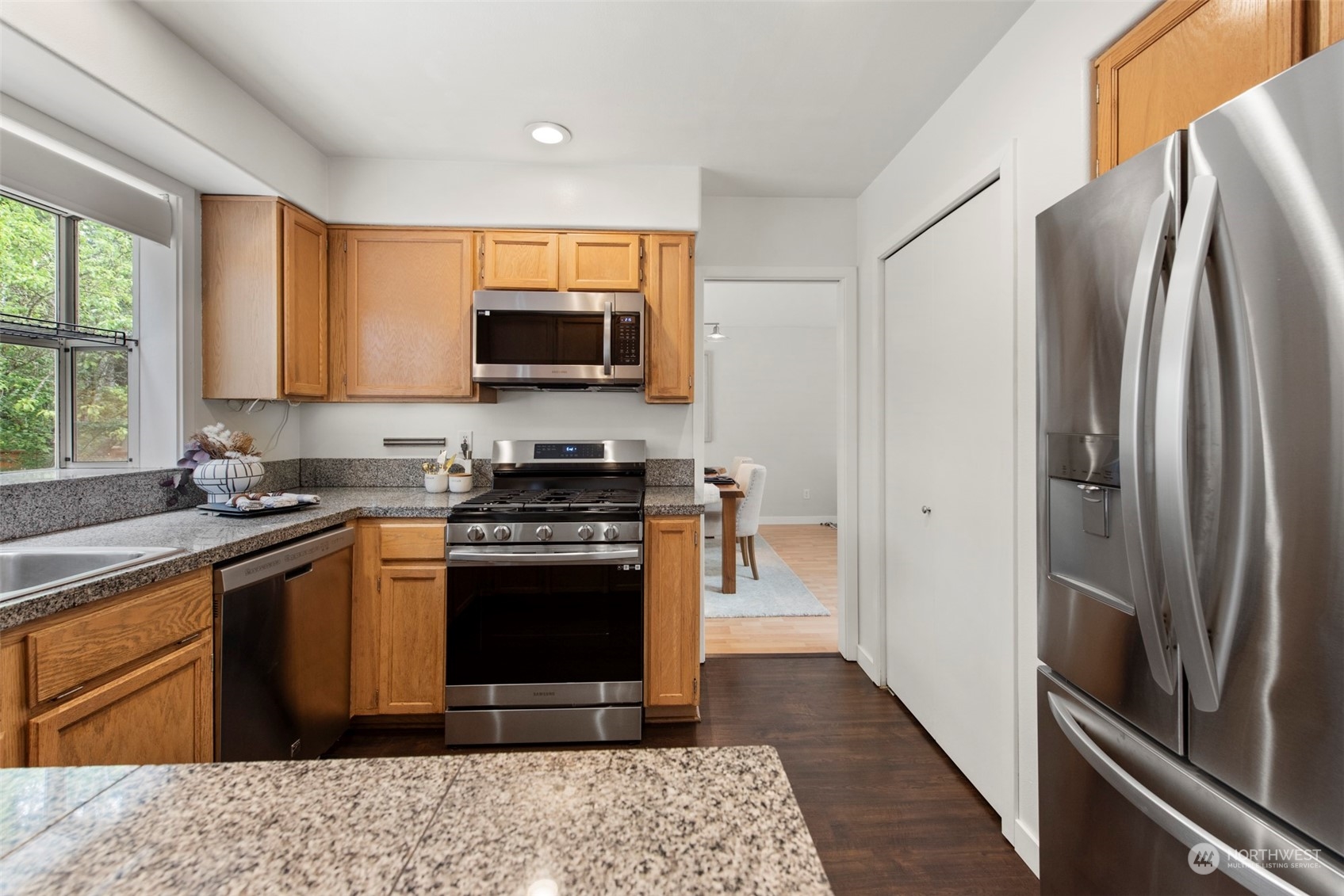 3545 252nd Place Southeast Sammamish, WA 98029 - Photo 12 of 31 a kitchen with stainless steel appliances granite countertop a refrigerator stove and microwave