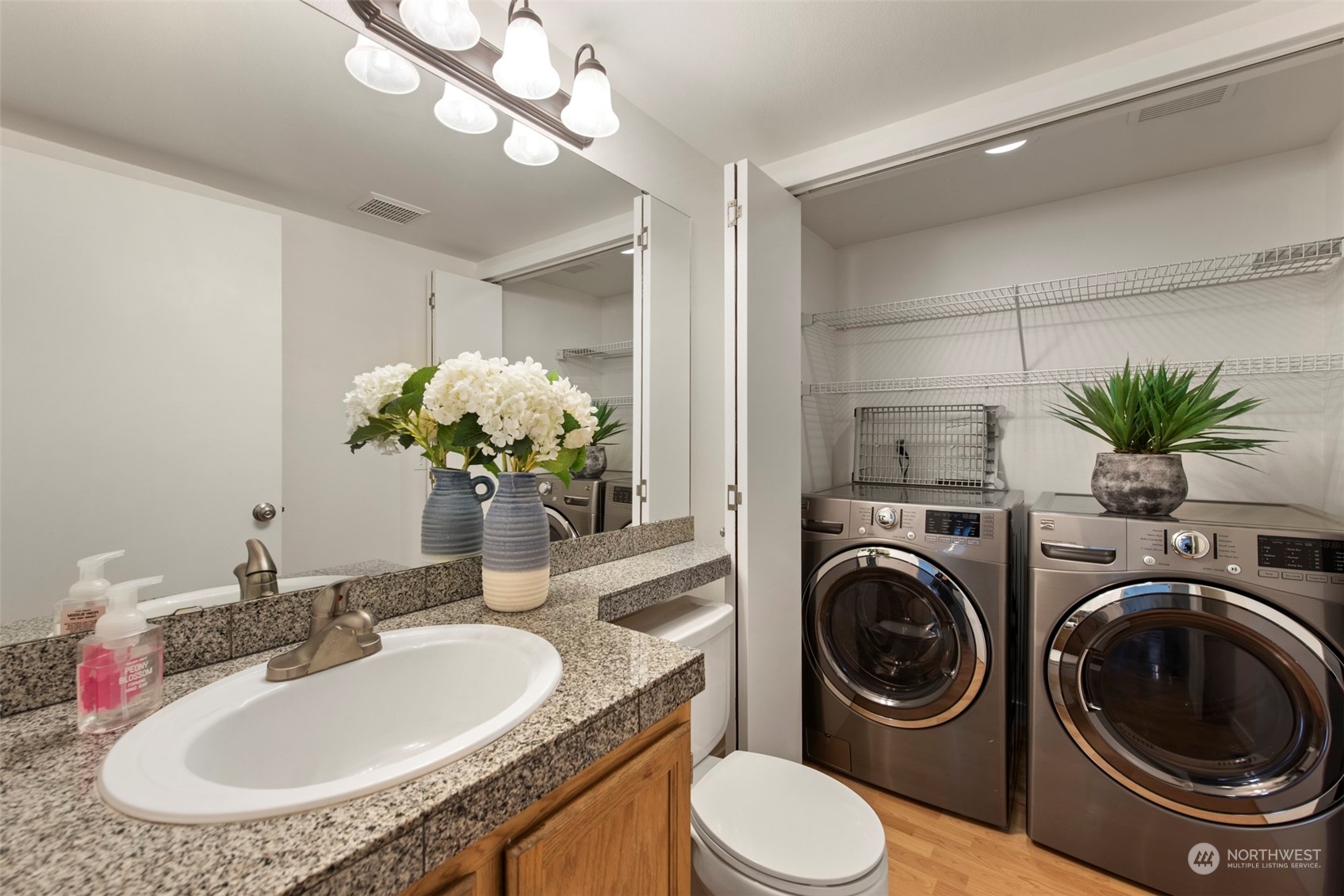 3545 252nd Place Southeast Sammamish, WA 98029 - Photo 13 of 31 a bathroom with a granite countertop double vanity and a sink