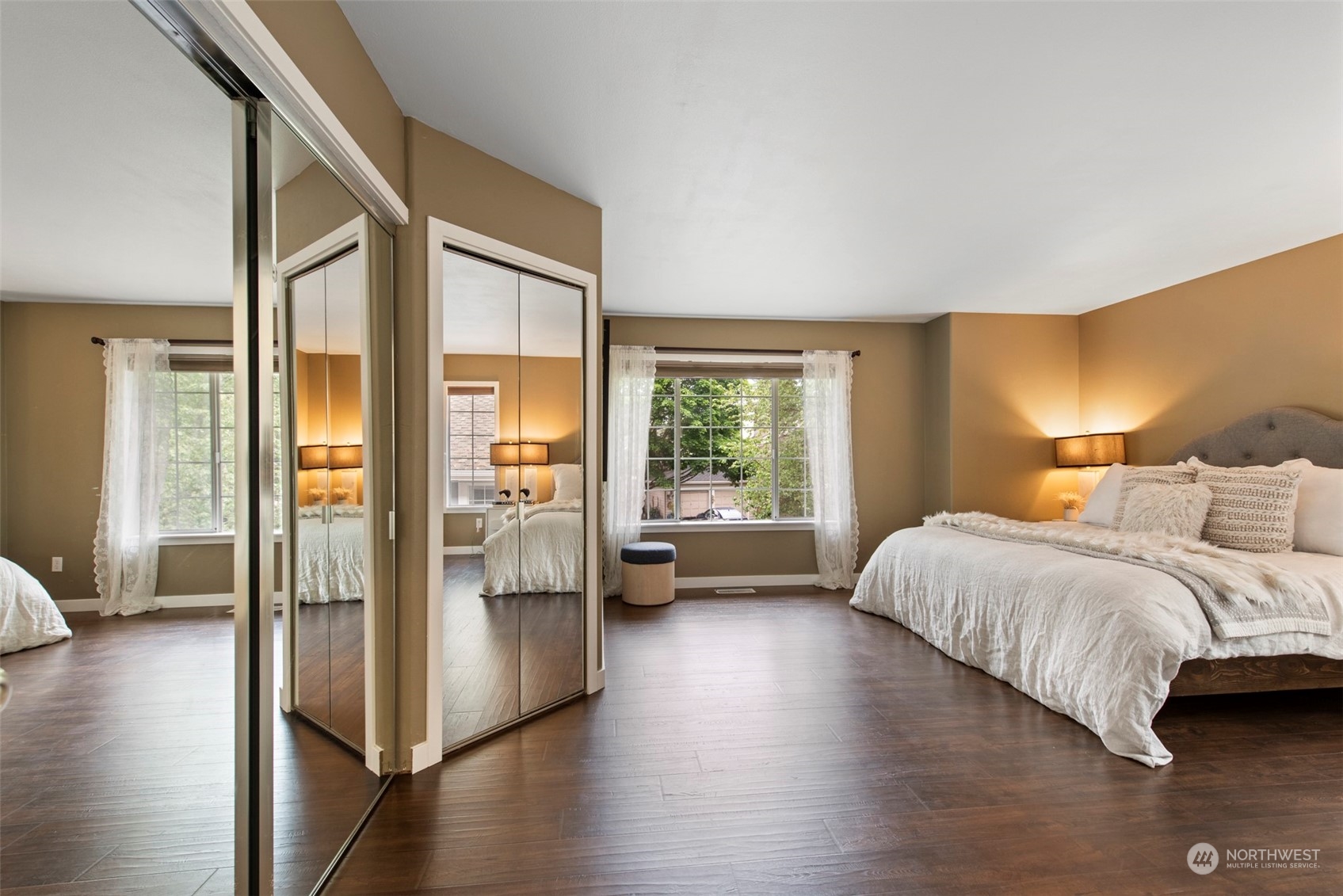 3545 252nd Place Southeast Sammamish, WA 98029 - Photo 15 of 31 a spacious bedroom with a bed and a large window with wooden floor