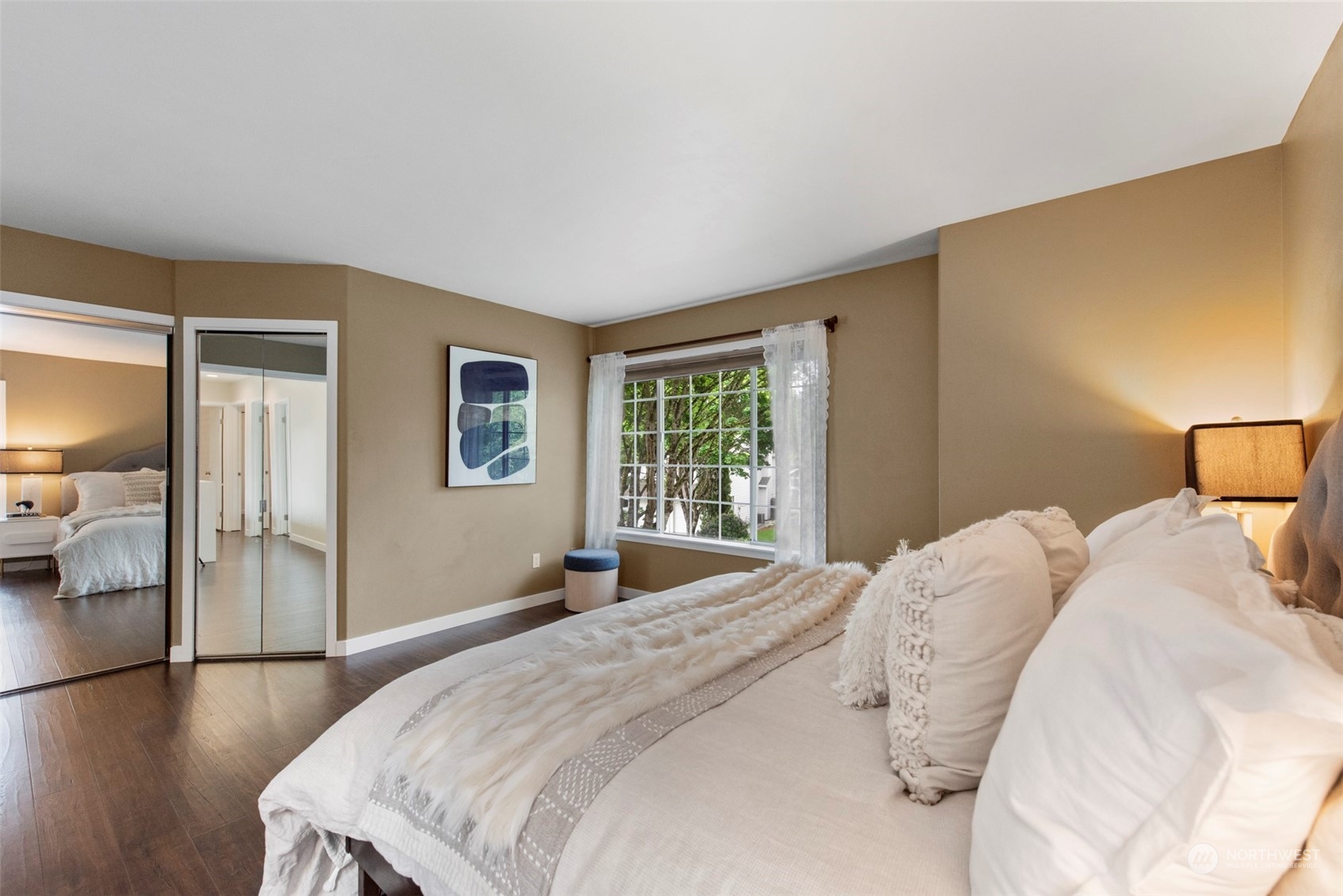 3545 252nd Place Southeast Sammamish, WA 98029 - Photo 16 of 31 a bedroom with a bed and wooden floor