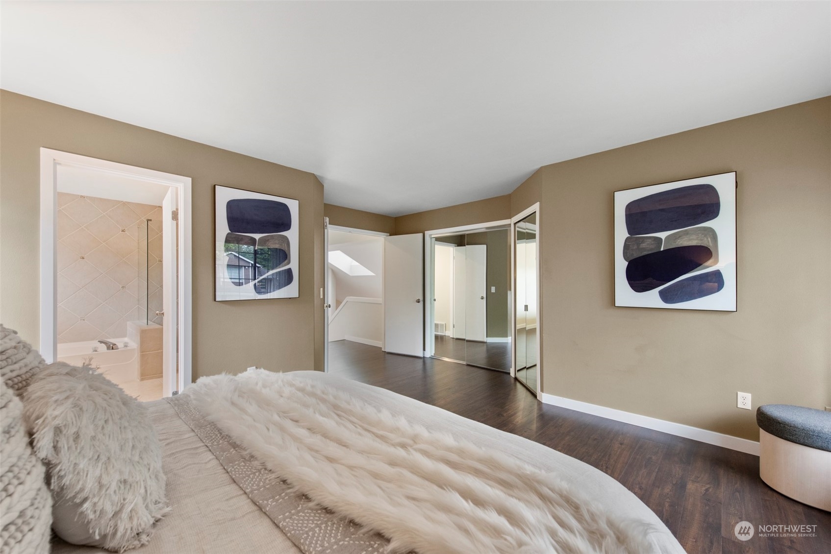 3545 252nd Place Southeast Sammamish, WA 98029 - Photo 17 of 31 a bedroom with a bed and a painting on the wall