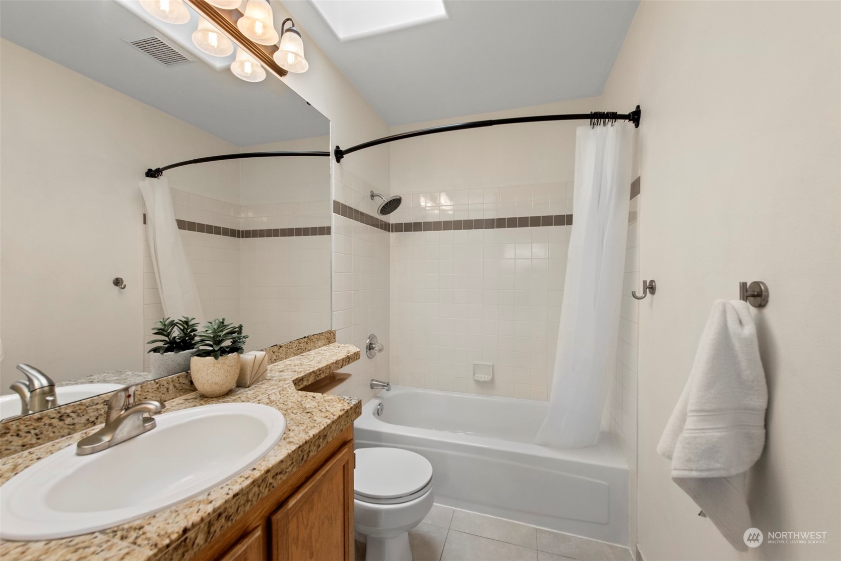 3545 252nd Place Southeast Sammamish, WA 98029 - Photo 22 of 31 a bathroom with a granite countertop sink toilet and shower