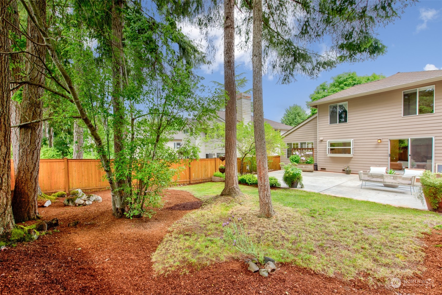 3545 252nd Place Southeast Sammamish, WA 98029 - Photo 25 of 31 a view of a house with backyard and sitting area