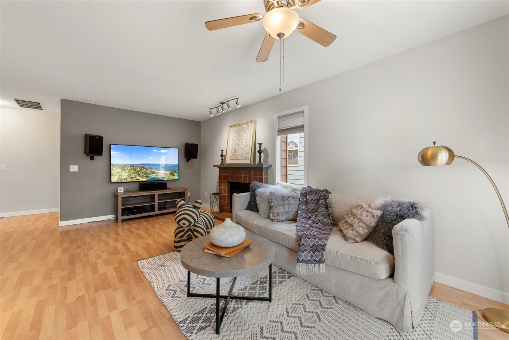 3545 252nd Place Southeast Sammamish, WA 98029 - Photo 7 of 31 a living room with furniture and a dining table with wooden floor