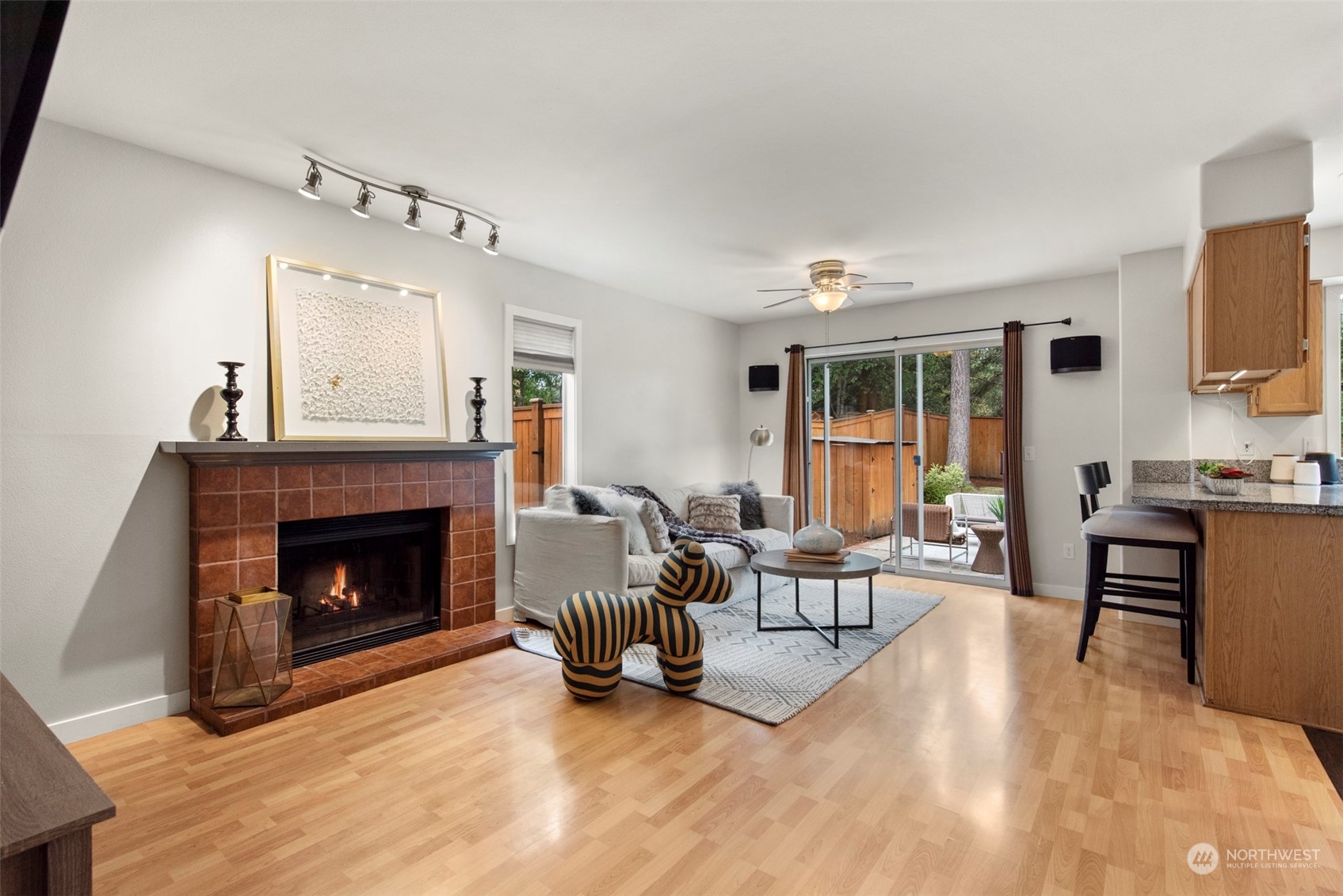 3545 252nd Place Southeast Sammamish, WA 98029 - Photo 8 of 31 a living room with furniture and a fireplace
