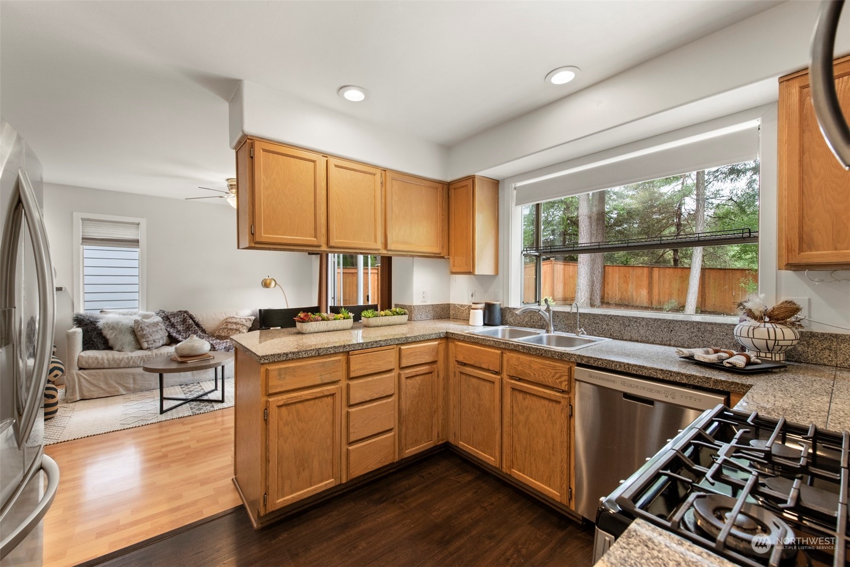 3545 252nd Place Southeast Sammamish, WA 98029 - Photo 10 of 31 a kitchen with a sink stove top oven and cabinets