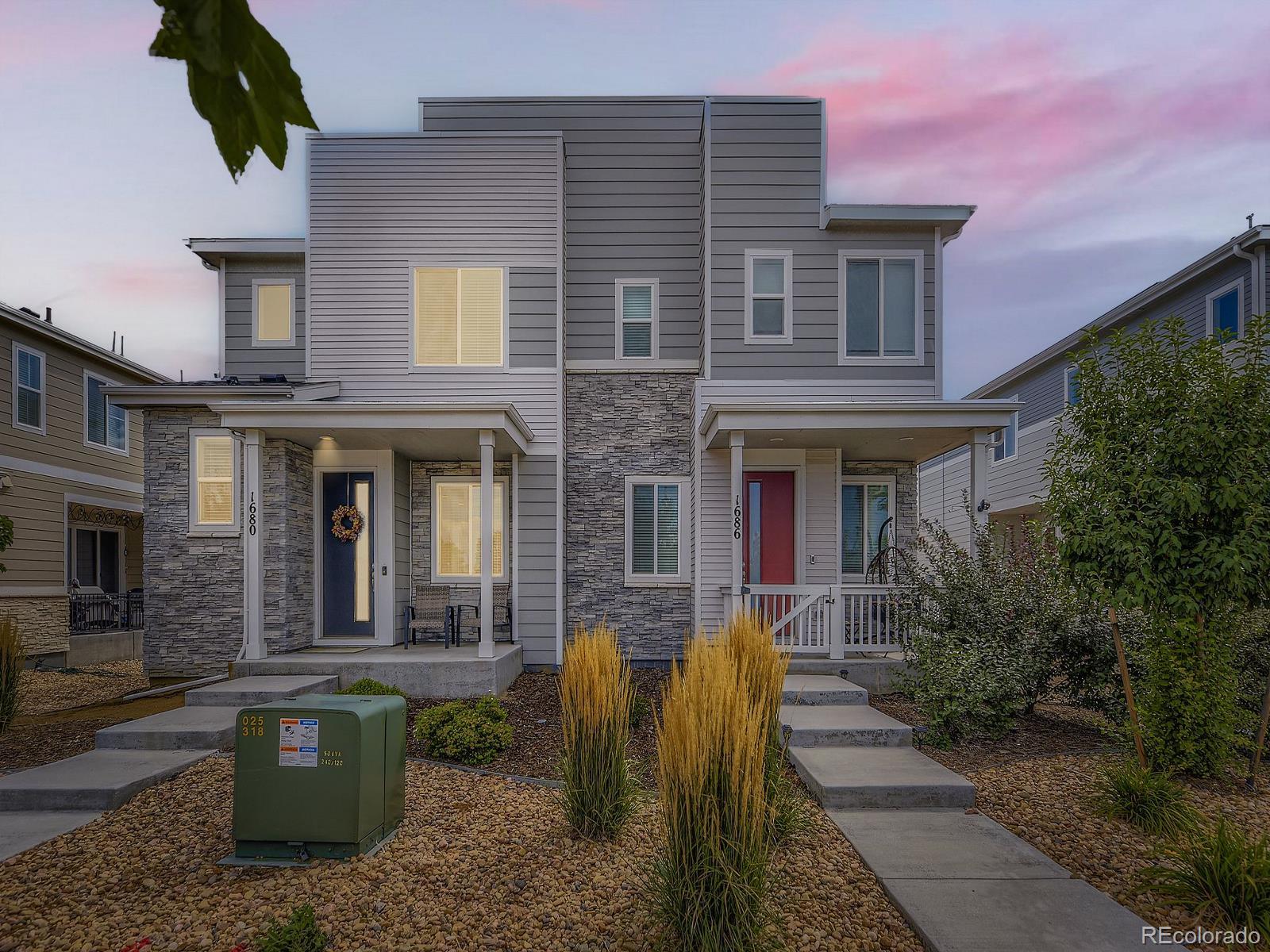 1680 South Tower Road Aurora, CO 80017 - Photo 1 of 26 a front view of a house with a yard