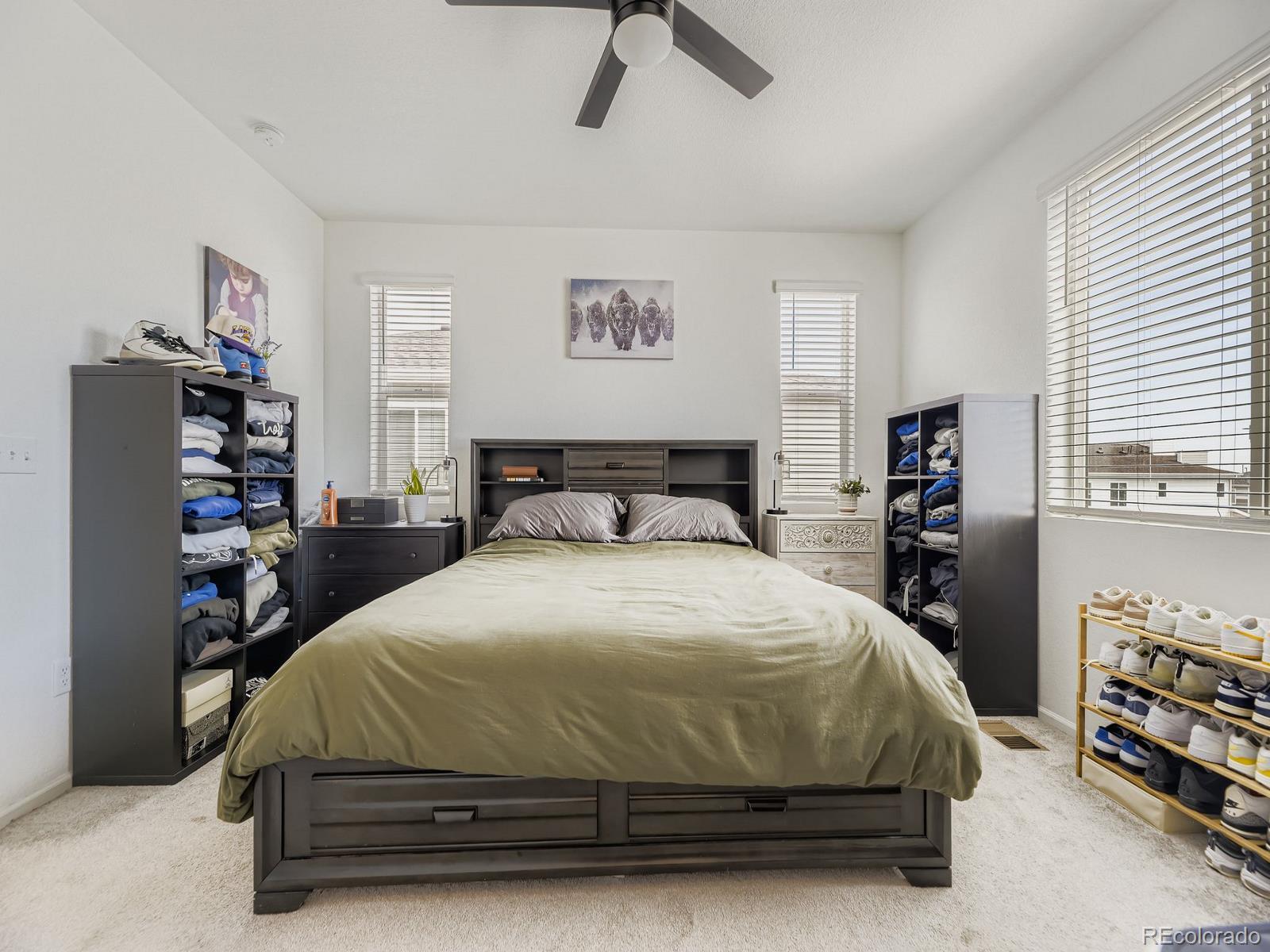 1680 South Tower Road Aurora, CO 80017 - Photo 17 of 26 a bedroom with a bed and a window
