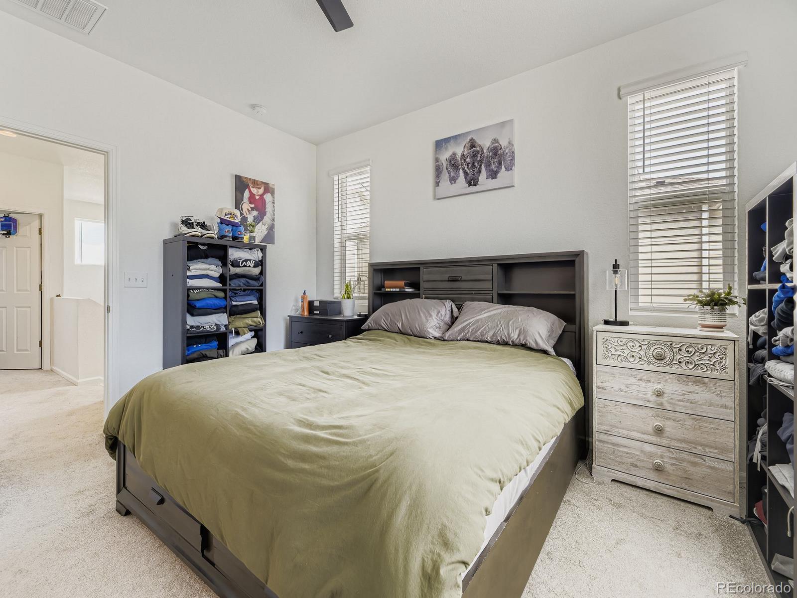 1680 South Tower Road Aurora, CO 80017 - Photo 18 of 26 a bedroom with a bed and a closet