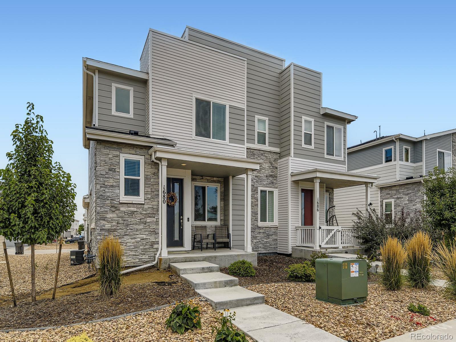 1680 South Tower Road Aurora, CO 80017 - Photo 2 of 26 a front view of a house with outdoor seating