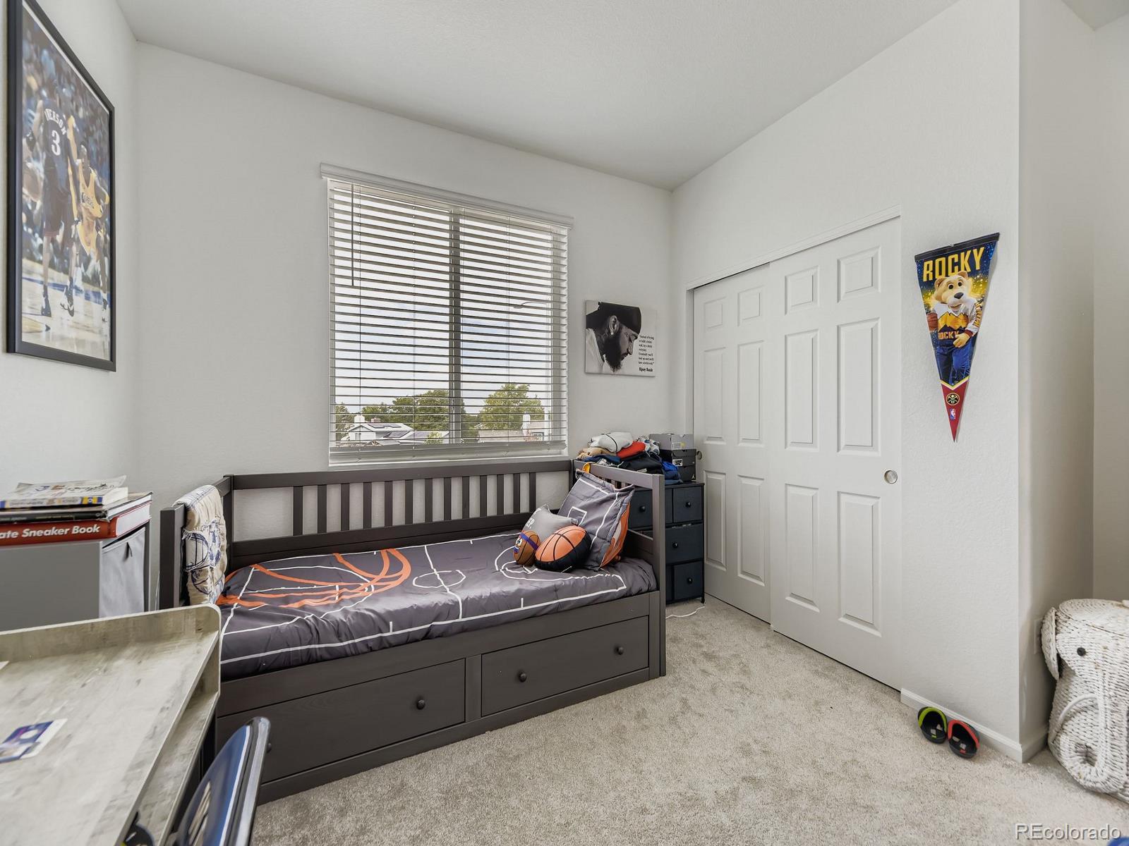 1680 South Tower Road Aurora, CO 80017 - Photo 22 of 26 a bedroom with furniture and a window